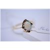 Image 1 : Ladies 10kt yellow gold ring set with oval cut opal gemstone