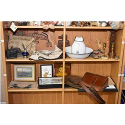 Two shelf lot of collectibles including leather and hand tooled purses, carved wooden pieces, totems