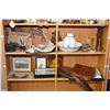 Image 1 : Two shelf lot of collectibles including leather and hand tooled purses, carved wooden pieces, totems