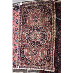 Antique wool throw rug with center medallion in blue, burgundy and tan, 28  X 48 