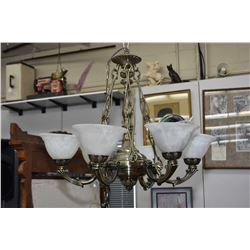 Modern antique brass coloured six branch chandelier with frosted glass shades