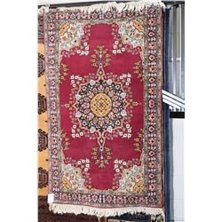 Wool throw rug with center medallion, multiple border in shades of burgundy, green gold and blue 35"