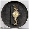 GIAN GIORGIO DOLPHIN BAND GOLD TONE WATCH.