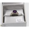 Image 1 : PURPLE STONE WITH WHITE STONES ON THE SIDE RING