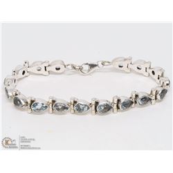 36) STERLING SILVER BLUE TOPAZ BRACELET
