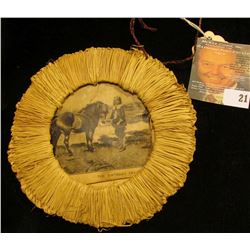 "Trevore Toilet Water" advertising Folk Art titled "The Present", woven reed frame with picture of h