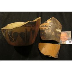 Unrestored Pot with shards. Black on brown Clay. No attribution.