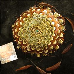 Indian Design Pheasant Feather head piece with green central stone.