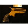 Image 1 : "C. Sharps & Co." Four-barreled .22 caliber Derringer with very ornate Bakelite Grips. Most likely t