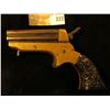 Image 2 : "C. Sharps & Co." Four-barreled .22 caliber Derringer with very ornate Bakelite Grips. Most likely t