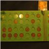 Image 1 : 1910-48S Partial Set of Lincoln Cents in a green Popular Album.