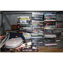 SHELF LOT OF CDS AND DVDS