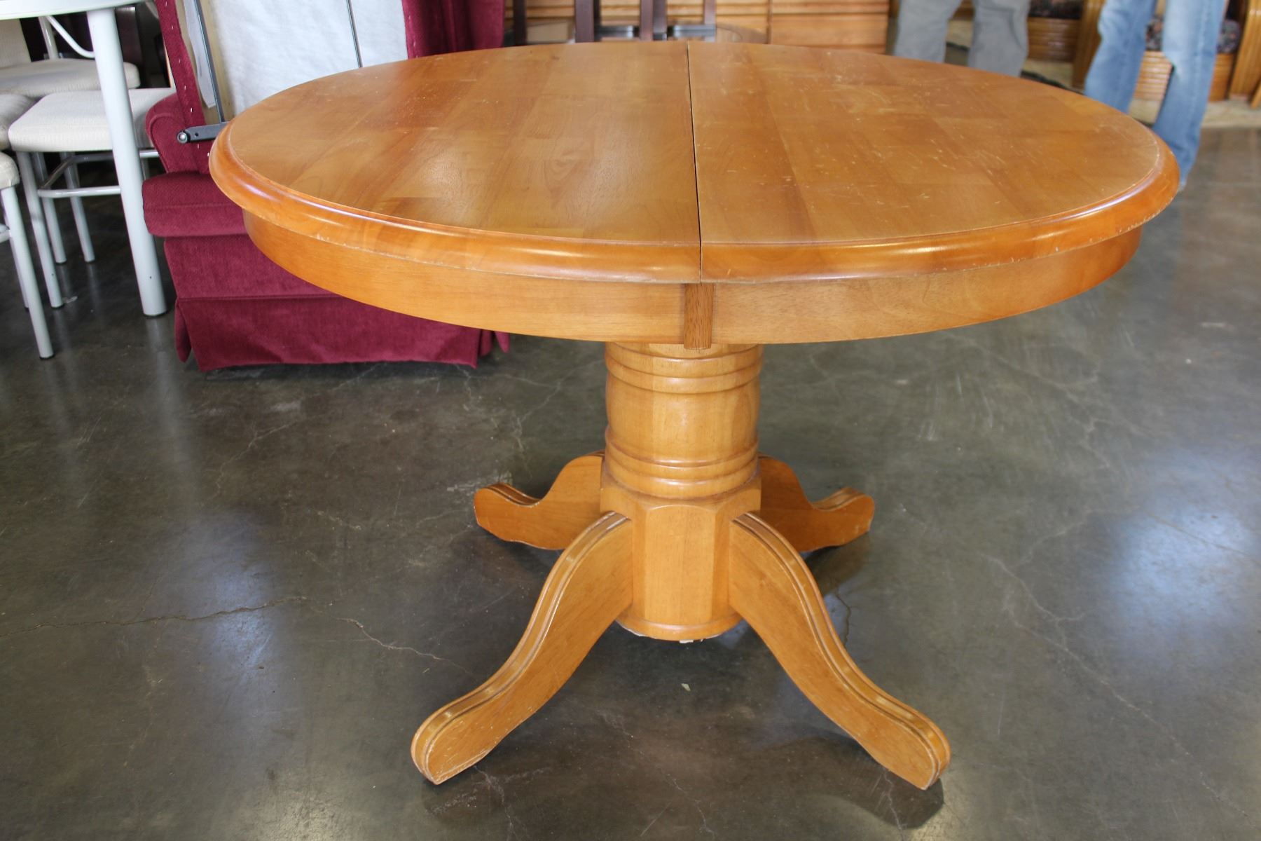 ROUND MAPLE DINING TABLE WITH JACK KNIFE LEAF AND FOUR OAK ROLLING