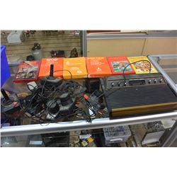 TOTE OF ATARI CONSOLE GAMES AND JOYSTICKS