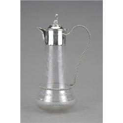 A Victorian claret jug, cut with fruiting vine above a frosted band, the plated wrigglework mount...