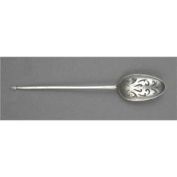 A mid-18th century mote spoon, the bowl pierced with stylised leaf scrolls, spear terminal, 13cm...