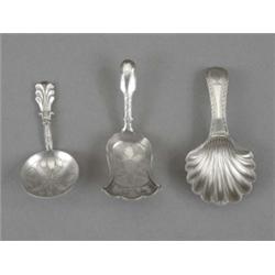A George III Fiddle pattern shovel bowl caddy spoon, pricked and engraved with a large flowerhead...