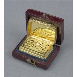 A William IV silver gilt rectangular vinaigrette, engine turned with vacant cartouche, cast flora...