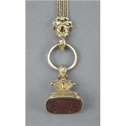 A good Regency gold fob seal, of reeded and lobed rounded rectangular form, carnelian matrix engr...