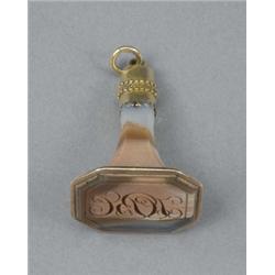 A George III gold mounted agate fob seal, of striking pink-grey colour, with filigree mount, the...