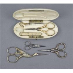 A Continental ivory necessaire, the oblong case enclosing a pair of engraved silver-gilt mounted...