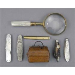 A travelling non-spill inkwell, in the form of leather covered Gladstone bag, 5.8cm wide; a Victo...