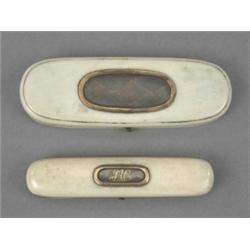 A George III gold mounted ivory toothpick case, the hinged cover with glazed hair panel set with...
