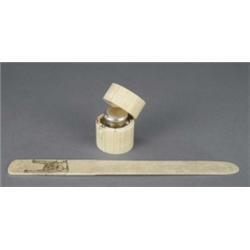 A cylindrical glass inkwell, with Sheffield plate hinged bun cover, contained in an ivory tusk se...