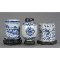 A Chinese reeded ovoid vase, with panels of foliage in blue, 14cm high, Kangxi; a brush pot, with...