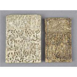 Two Chinese ivory rectangular card cases, deeply carved overall with hillside village scenes busy...
