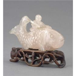 A Chinese rose quartz carving of Kinko Sennin riding the giant carp, 15.5cm long, early 20th cent...