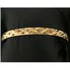 Image 1 : Gold Bangle Bracelet With Colored Accents To Resemble Emerald, Sapphire, and Ruby Gemstones