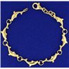 Image 1 : Dolphin Bracelet in 14k Gold