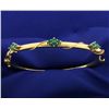 Image 1 : Emerald Bangle Bracelet in 14k Gold