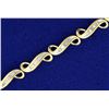 Image 2 : Baguette Diamond Tennis Bracelet in 14K Yellow and White Gold
