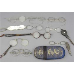 Eight pairs of 19th century spectacles of varying design, including silver coloured metal, gilt m...
