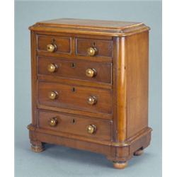 A Victorian mahogany miniature chest, fitted two short and three long drawers with cockbeaded mou...