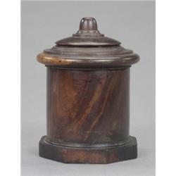 A Regency lignum vitae cylindrical string box, on an octagonal base beneath a pierced domed and m...