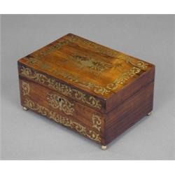A post-Regency rosewood box, the hinged lid and front inlaid with brass leafy strapwork and escut...