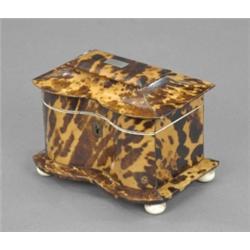 A William IV tortoiseshell veneered two-compartment tea caddy, of double bow form, the conforming...
