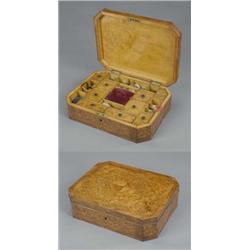 A good thuya and kingwood canted rectangular needlework box, outlined with double chevron borders...