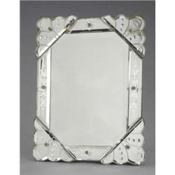 A late 19th century Venetian glass easel toilet mirror, of shaped rectangular outline, the bevell...