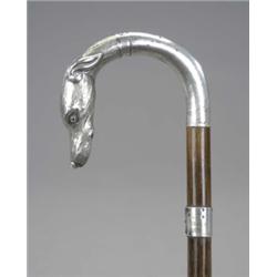 A silver mounted malacca cane, the greyhound head handle with glass eyes, 88cm (marks rubbed) 120...