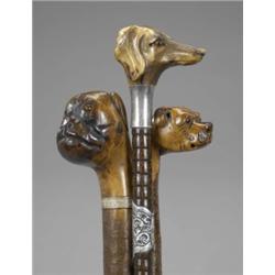 Three walking sticks, with primitive carved dog's head handles 150/180...