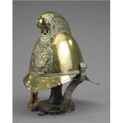 A 19th century brass fireman's helmet, with chain-link chin strap (faults) 30/50...