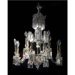 A large cut glass five-light chandelier, of Regency bag shape, festooned with faceted beads and h...