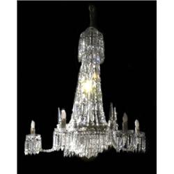A good 19th century cut glass chandelier, the eighteen scroll branches arranged in three tiers su...