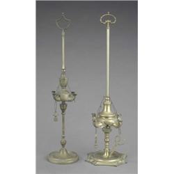 A George III brass four-light oil adjustable lamp of classical creuse form, the slender stem with...