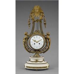 A French ormolu mounted white marble mantel clock, in Louis XVI style, the circular white enamell...