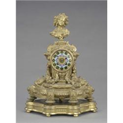 A French gilt metal mantel clock, the colourful cloisonne enamel circular dial with gilt Roman nu...